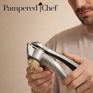 Unopened Pampered Chef Silver Garlic Press New in Box